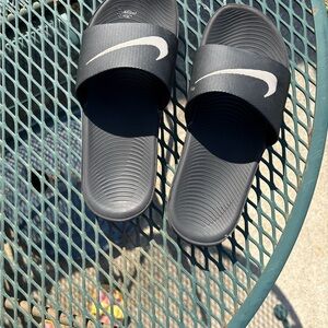 Nike Black Slide Sandals with White Swoosh Accent